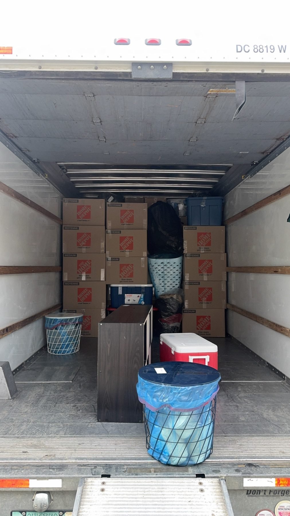 Box truck packed for a residential move, Home Depot boxes stacked tight
